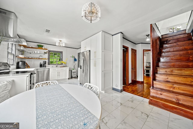 dining space with crown molding