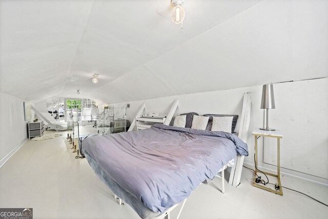 bedroom featuring vaulted ceiling