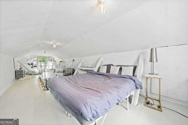 bedroom featuring lofted ceiling