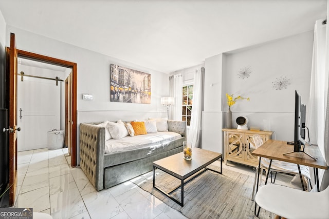 living room featuring a barn door