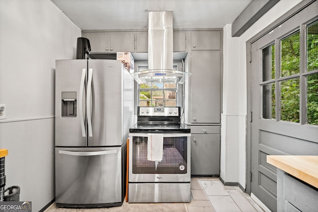 kitchen with gray cabinetry, stainless steel appliances, and island exhaust hood