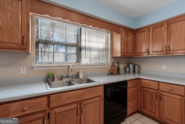 kitchen with sink, light tile patterned floors, and dishwasher