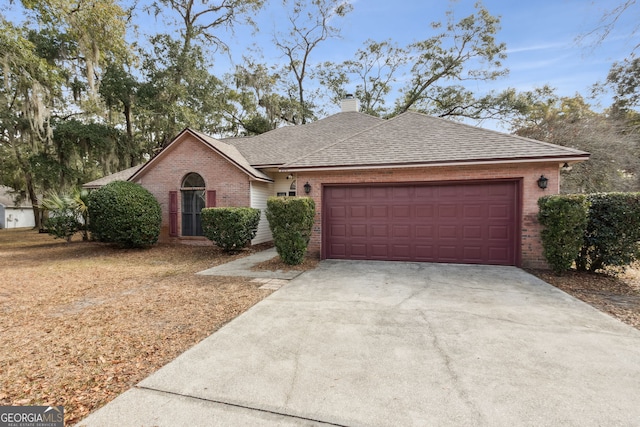 single story home with a garage