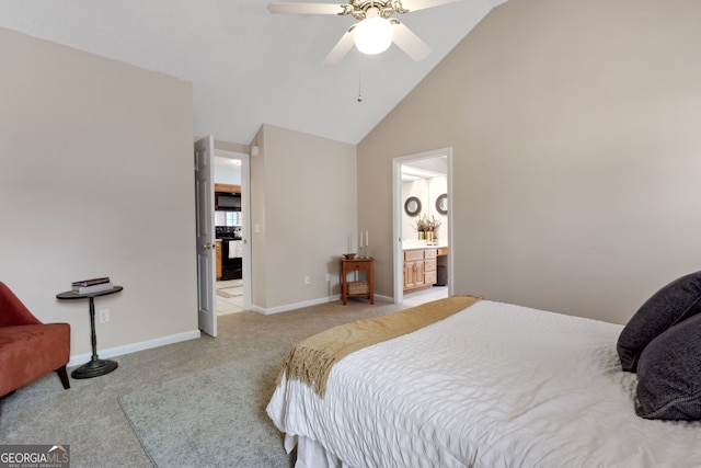 bedroom with connected bathroom, high vaulted ceiling, light colored carpet, and ceiling fan