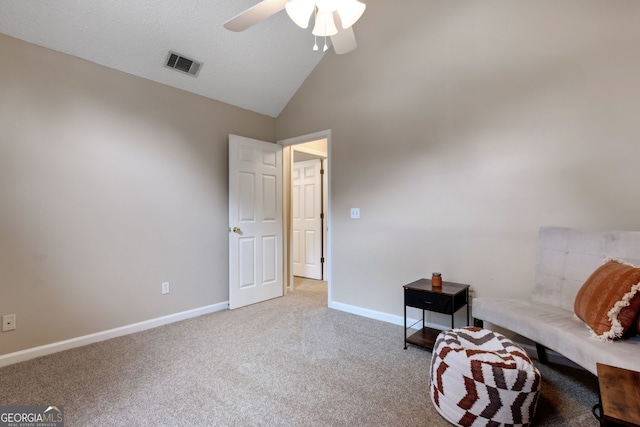 unfurnished room with high vaulted ceiling, light carpet, and ceiling fan