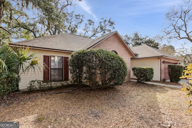 view of property exterior featuring a garage