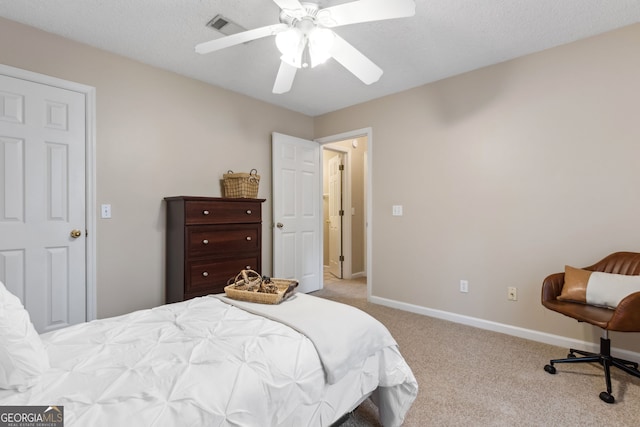 bedroom featuring ceiling fan and light carpet