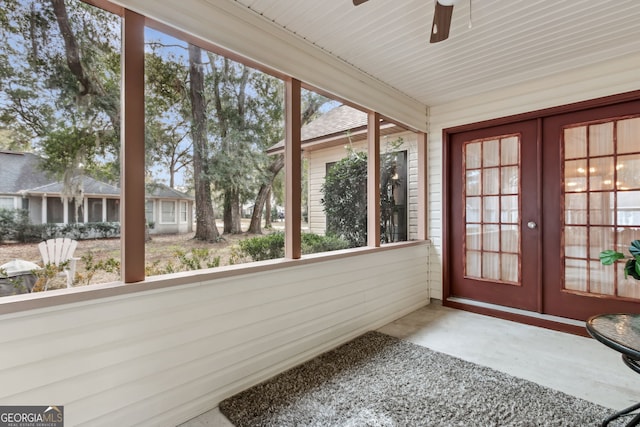 unfurnished sunroom featuring french doors