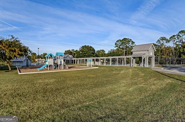 view of jungle gym featuring a lawn