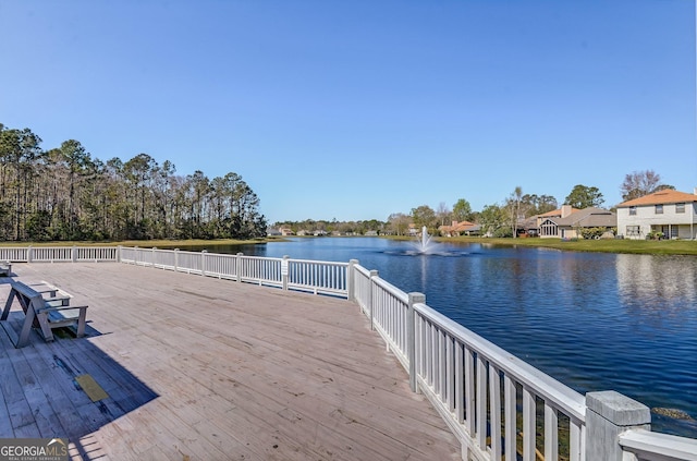 dock area with a deck with water view