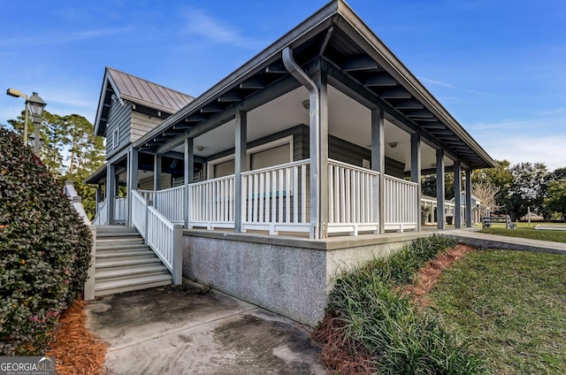 view of property exterior with covered porch