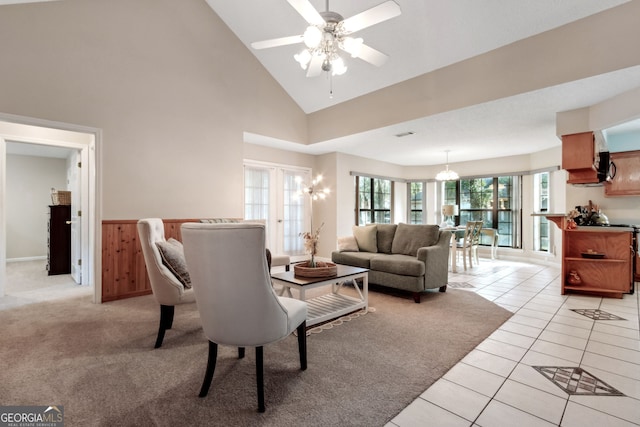 living room featuring light tile patterned floors, high vaulted ceiling, and ceiling fan