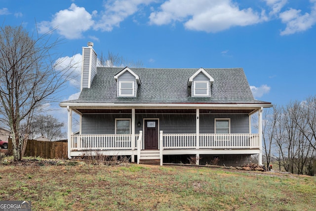 view of front of house featuring covered porch and a front yard