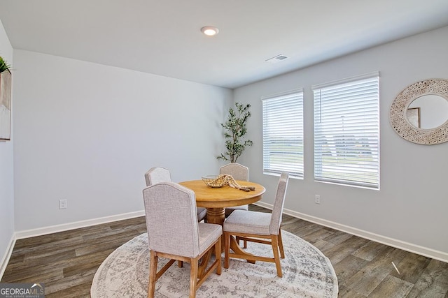 dining room with dark wood-type flooring