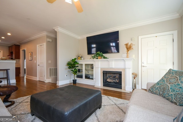 6422 Paulson, Atlanta, GA 30328 - living area featuring a fireplace with flush hearth, wood finished floors, baseboards, visible vents, and crown molding