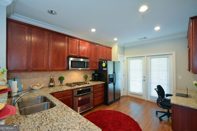 6422 Paulson, Atlanta, GA 30328 - kitchen with appliances with stainless steel finishes, light wood-type flooring, a sink, and crown molding