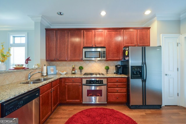 6422 Paulson, Atlanta, GA 30328 - kitchen with appliances with stainless steel finishes, a sink, light wood finished floors, and light stone countertops