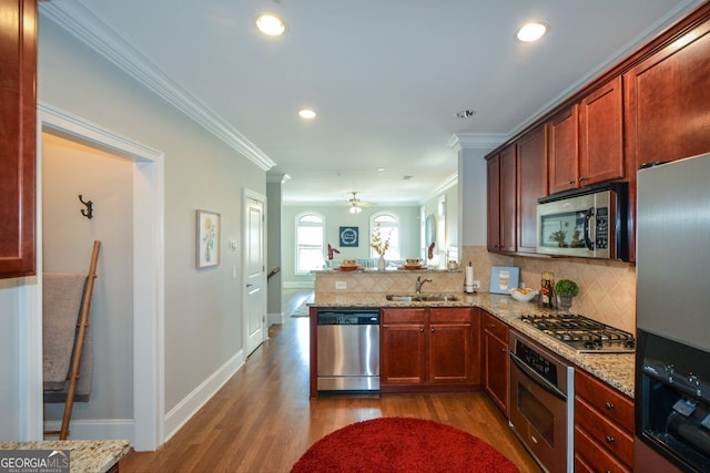 6422 Paulson, Atlanta, GA 30328 - kitchen with tasteful backsplash, appliances with stainless steel finishes, ornamental molding, a peninsula, and a sink