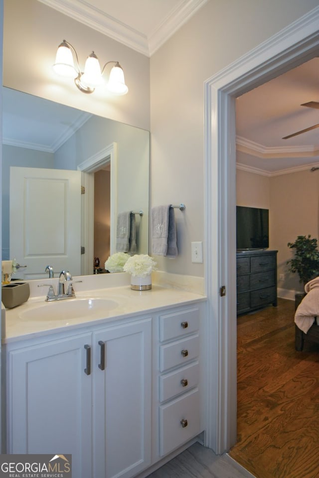 6422 Paulson, Atlanta, GA 30328 - bathroom featuring ceiling fan, vanity, crown molding, and wood finished floors
