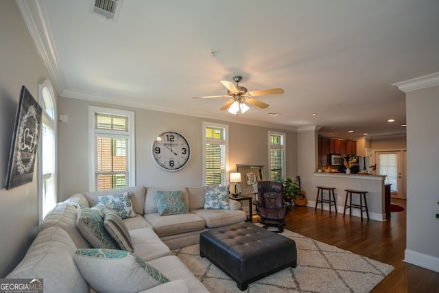 6422 Paulson, Atlanta, GA 30328 - living area with dark wood-style floors, visible vents, crown molding, and baseboards