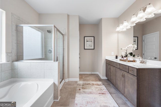 bathroom with vanity, independent shower and bath, and tile patterned flooring