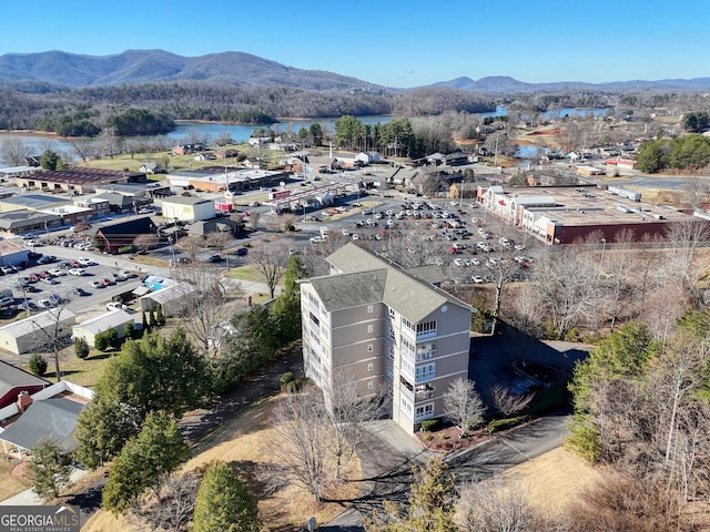 bird's eye view with a water and mountain view