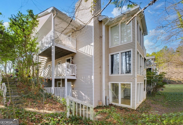 rear view of house featuring a balcony