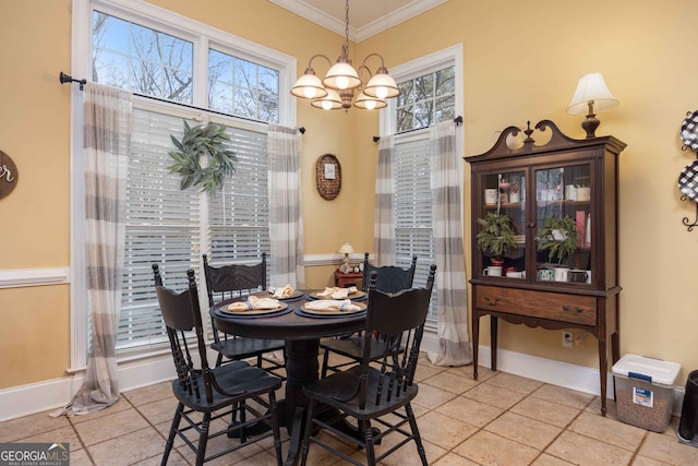 dining space featuring crown molding and a chandelier