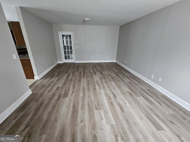 unfurnished room with light wood-type flooring