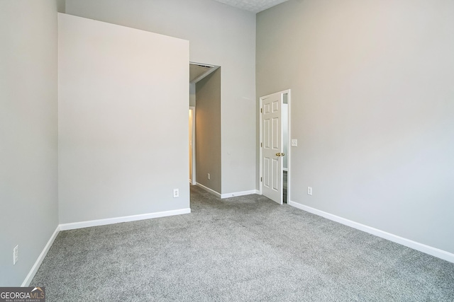 empty room with carpet flooring