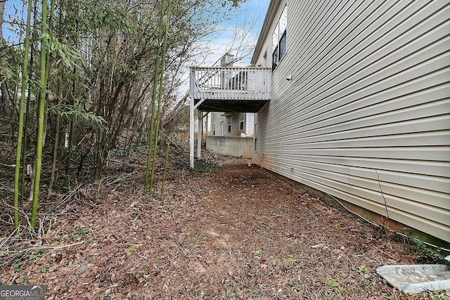 view of side of home with a deck