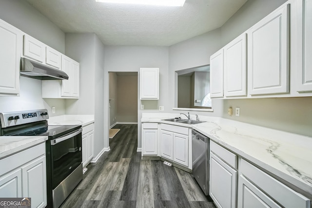 kitchen with stainless steel appliances, white cabinetry, sink, and dark hardwood / wood-style flooring