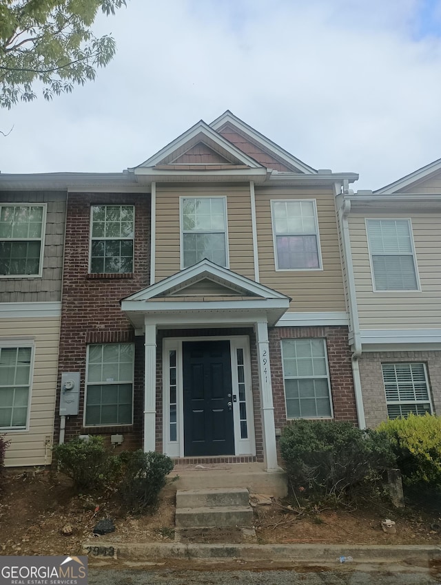 multi unit property featuring brick siding