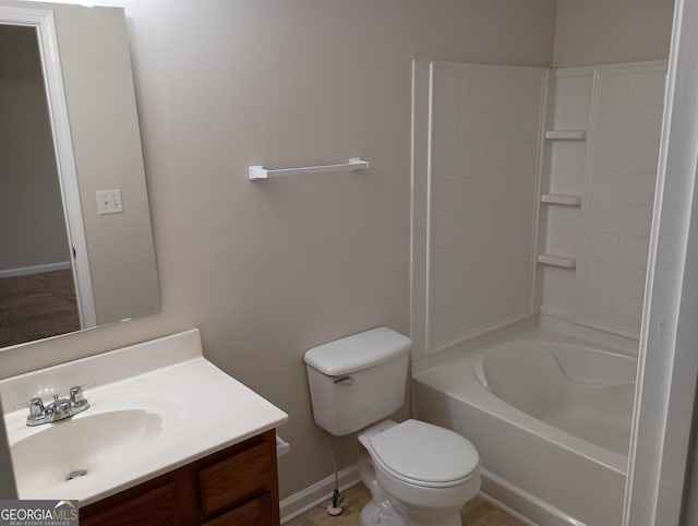 bathroom with bathtub / shower combination, vanity, and toilet