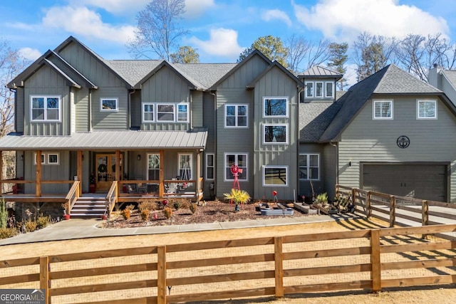 view of front facade with a garage and covered porch