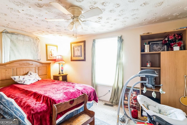 bedroom with ceiling fan and carpet