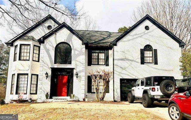 view of front of house featuring a garage and a front yard