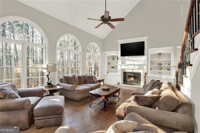 559 Fairway Dr, Woodstock, GA 30189 - living area with a ceiling fan, high vaulted ceiling, wood finished floors, and a healthy amount of sunlight