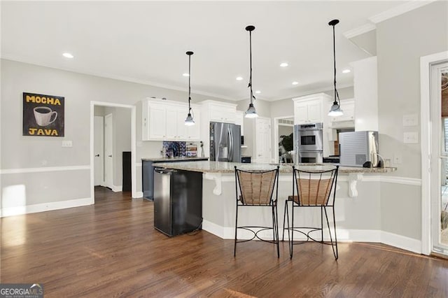 kitchen featuring a peninsula, appliances with stainless steel finishes, light stone countertops, and white cabinets