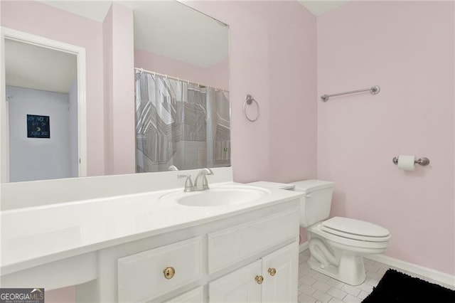 full bathroom with vanity, toilet, and tile patterned floors