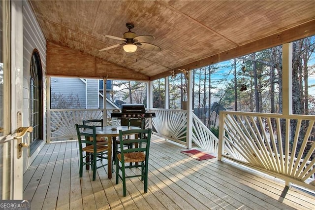 unfurnished sunroom featuring lofted ceiling, wooden ceiling, and ceiling fan