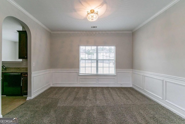 carpeted empty room with ornamental molding