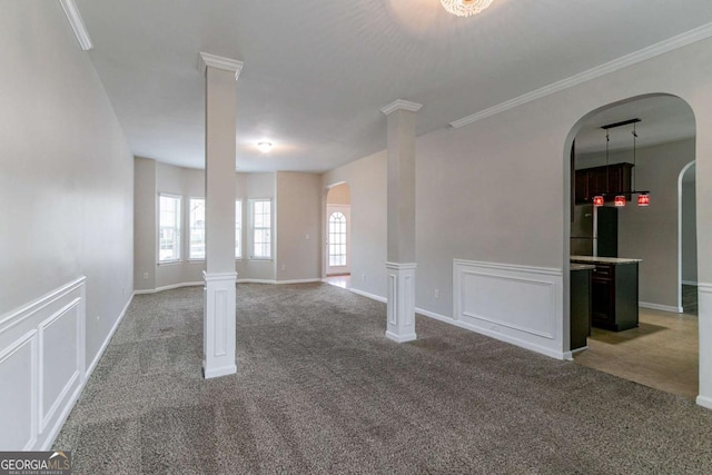 carpeted spare room with ornamental molding