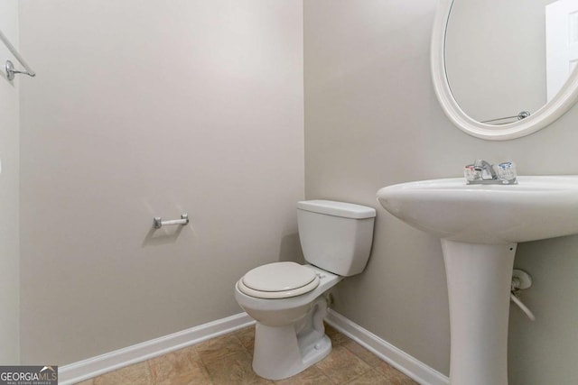 bathroom featuring toilet