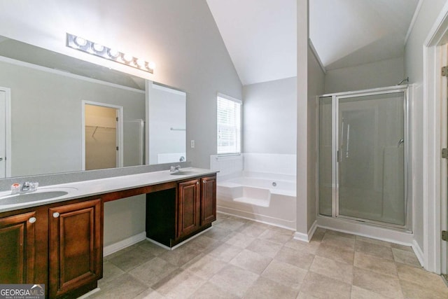 bathroom featuring vanity, plus walk in shower, and vaulted ceiling