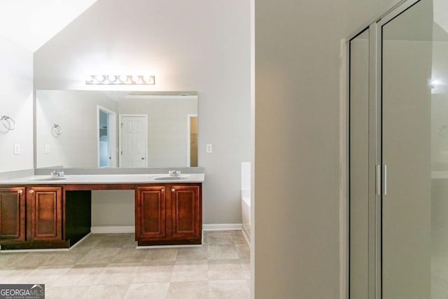 bathroom with lofted ceiling, plus walk in shower, and vanity