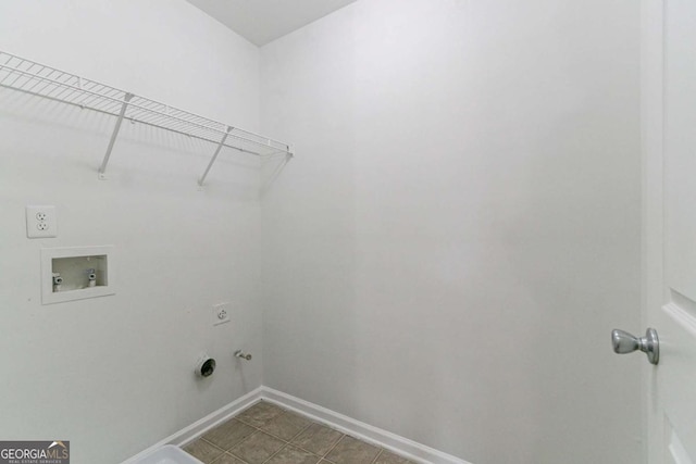 laundry room with gas dryer hookup, hookup for a washing machine, tile patterned floors, and hookup for an electric dryer