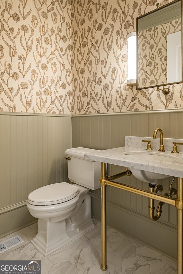 bathroom with sink and toilet