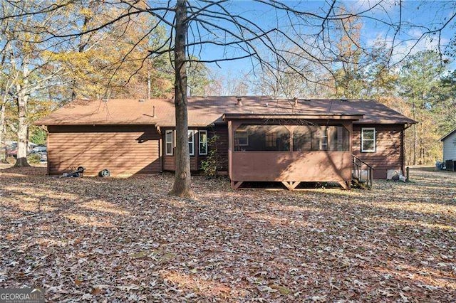 back of house with a sunroom