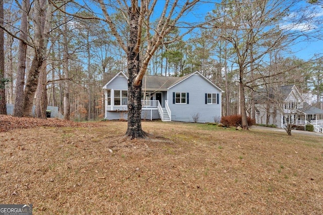 ranch-style house featuring a front yard